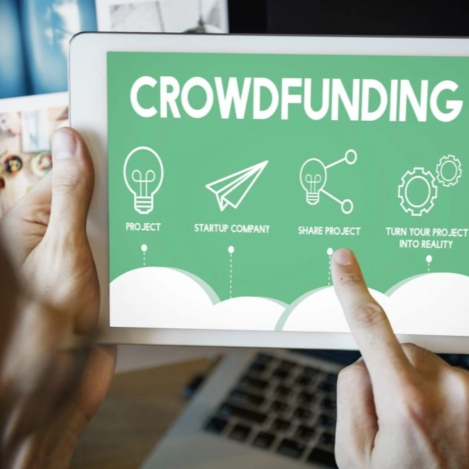 Crowdfunding website mockup on a tablet in green and white colours.